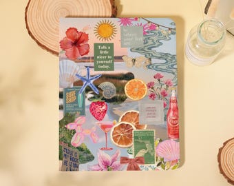 May include: A decorative journal with a collage design featuring a beach theme. The journal includes images of a starfish, seashells, flowers, and the text "Talk a little nicer to yourself today."