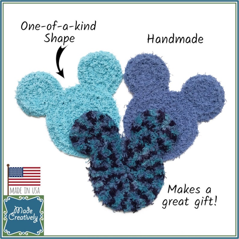 May include: Three handmade, fuzzy, blue and turquoise Mickey Mouse-shaped ornaments. The ornaments are made in the USA and are a great gift. The text "One-of-a-kind Shape" and "Handmade" are written on the image.
