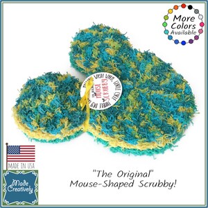 May include: A green and yellow mouse-shaped dish scrubber with the text "The Original Mouse Scrubby!" and "Triple Duty Dish, Wash, Lint, Gentle Cycle" on a white background.