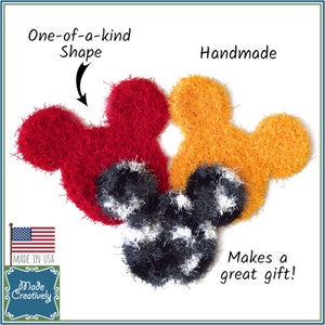 May include: Three handmade crocheted Mickey Mouse-shaped dishcloths in red, yellow, and black and white. The dishcloths are made in the USA and are a great gift.