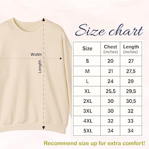 May include: Cream-colored sweatshirt with a crew neck. A size chart is displayed, showing chest and length measurements in inches for sizes S to 5XL. The text "Recommend size up for extra comfort!" is at the bottom.