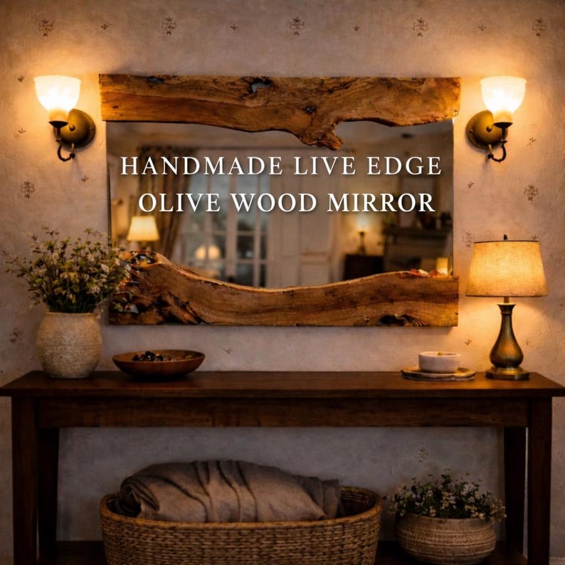 Handmade live edge olive wood mirror mounted above a wooden console table in a warm rustic interior