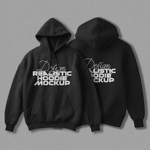 以下が含まれることがあります： 前面に「Design Realistic Hoodie Mockup」という文字が印刷された黒いフード付きスウェットシャツ2枚。テキストは白でスタイリッシュなフォントです。