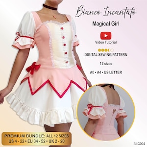 May include: A digital sewing pattern for a dress titled Bianco Incantato Magical Girl. The dress is pink and white with puff sleeves, red buttons, and a ruffled hem. The image includes a video tutorial icon, 12 sizes, and A0, A4, and US Letter formats.