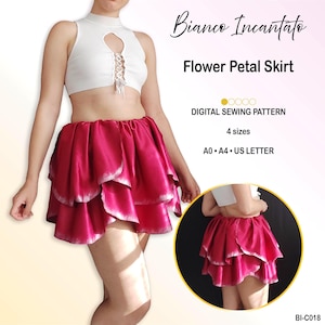 May include: A digital sewing pattern for a flower petal skirt titled Bianco Incantato. The skirt features layered, fuchsia-colored fabric petals with white edges. The pattern includes 4 sizes and is available in A0, A4, and US Letter formats.