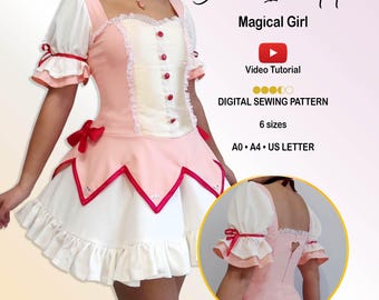 May include: A digital sewing pattern for a dress titled Bianco Incantato Magical Girl. The dress is pink and white with puff sleeves, red buttons, and a ruffled hem. An inset shows the back with a heart-shaped cutout. Includes 6 sizes.