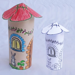 May include: Two handmade paper tube houses. One is colored with a red roof, blue window frame, and brown door. The other is a black and white outline. Both have a bunny, plant, and vine details. A fun craft project.