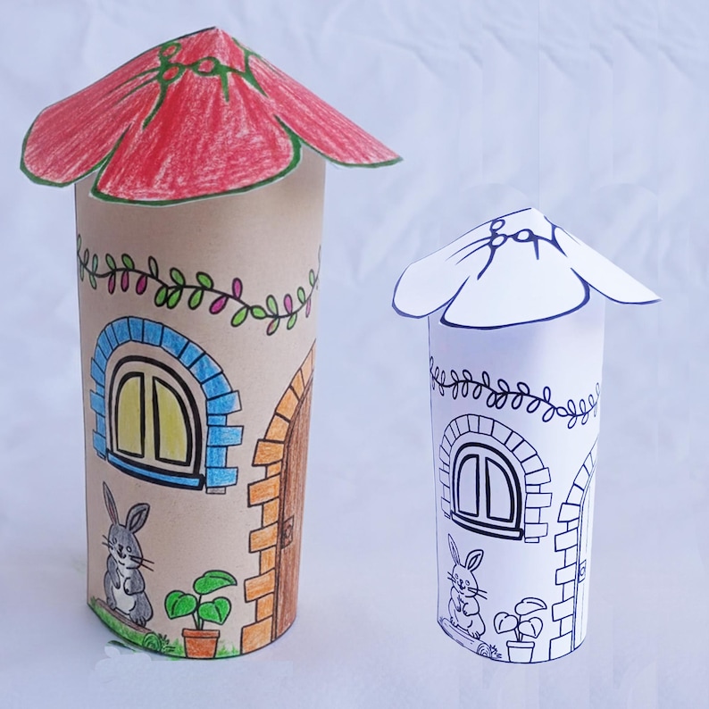 May include: Two handmade paper tube houses. One is colored with a red roof, blue window frame, and brown door. The other is a black and white outline. Both have a bunny, plant, and vine details. A fun craft project.