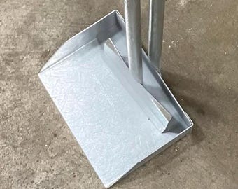Dog pooper scooper.  Made in the USA! Kis method, Keep It Simple! Pan design with paddle on stick. Made to last the test of time.