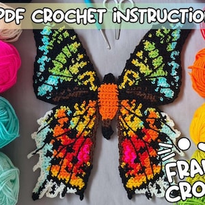 May include: A colorful, crocheted butterfly with black, orange, yellow, and blue wings. The text "PDF CROCHET INSTRUCTIONS" and "FRANTIC CROCHET" are visible. Various colored yarn balls, including pink, teal, red, orange, and yellow, surround the butterfly.