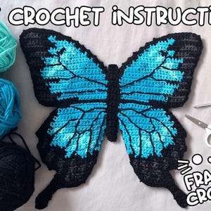 May include: A crocheted butterfly in shades of blue and black, with the text "PDF CROCHET INSTRUCTIONS" and "FRANTIC CROCHET". The image also includes balls of yarn, a crochet hook, and scissors.