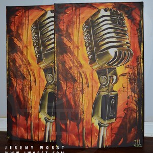 May include: Two vintage microphones painted on canvas with a yellow, orange, and brown background. The microphones are silver and have a black switch. The artist's signature is in the bottom right corner.