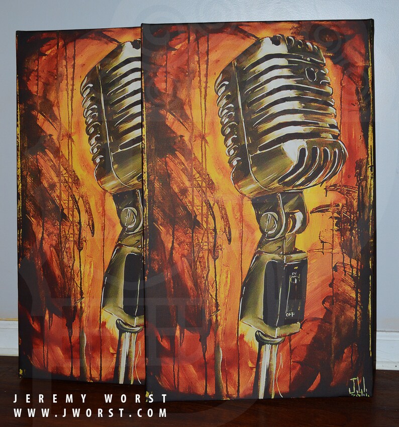 May include: Two vintage microphones painted on canvas with a yellow, orange, and brown background. The microphones are silver and have a black switch. The artist's signature is in the bottom right corner.