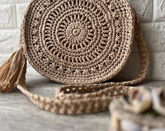 Round handmade raffia handmade shopper with long strap and zipper in boho style