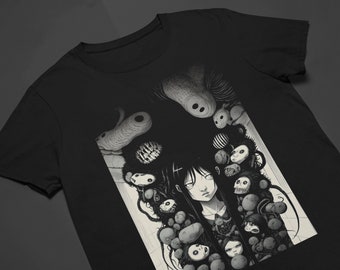 May include: Black and white graphic t-shirt featuring a woman with long black hair surrounded by a multitude of small, grotesque, and unsettling creatures.