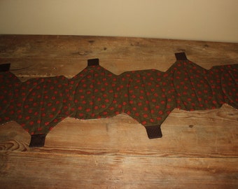 Row of pumpkins fall quilted table runner