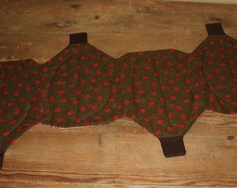 Row of pumpkins fall quilted table runner