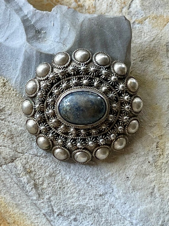 Bluestone brooch 2024