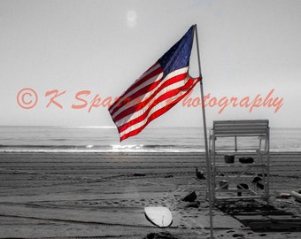 Long Branch, New Jersey, September 11, 2021 - beach, ocean, Jersey Shore, America, American Flag, Sunrise, Sunburst, lifeguard, waves, sand