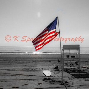 Long Branch, New Jersey, September 11, 2021 - beach, ocean, Jersey Shore, America, American Flag, Sunrise, Sunburst, lifeguard, waves, sand