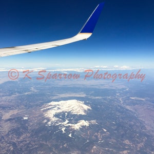 Above the Clouds - Photograph of earth from 30,000 feet - Rocky Mountains