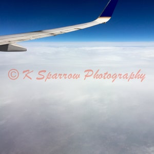 Above the Clouds - Photograph of earth from 30,000 feet