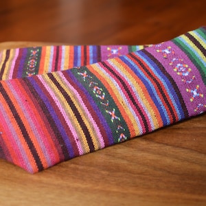Mens dress tie made from colorful, traditional Guatemalan fabric.
