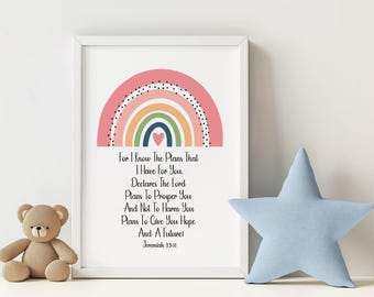 May include: A printable wall art design featuring a rainbow with a heart in the center and a quote from Jeremiah 29:11. The quote reads "For I know the plans that I have for you. Declares the Lord. Plans to prosper you and not to harm you. Plans to give you hope and a future!"