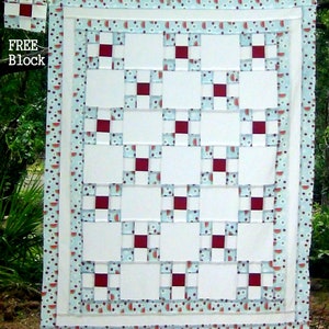 May include: A white quilt with a red and white checkerboard pattern in the center. The quilt is surrounded by a blue and white border with a watermelon print. The text "FREE BLOCK" is in the upper left corner of the image.