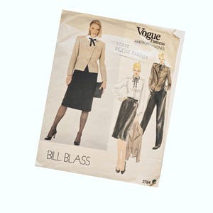 May include: Vintage Vogue Patterns sewing pattern for a Bill Blass design. The pattern is for a skirt and jacket set. The pattern is printed on a white background with black text. The pattern number is 2764.