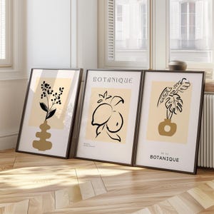 Juego de arte de pared botánico minimalista, impresiones abstractas en beige y negro con jarrón, limón y hoja de monstera