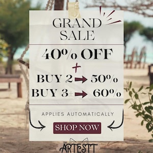 May include: A rectangular sign with the words "GRAND SALE" at the top, followed by "40% OFF" and additional discounts for multiple purchases. The sign includes the text "SHOP NOW" and the brand logo "THE ARTESTT".