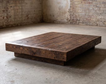May include: A low-profile platform bed frame constructed from dark brown stained wooden planks. The rectangular structure features a visible wood grain texture and a recessed base, creating a flat, elevated surface for a mattress to rest upon.