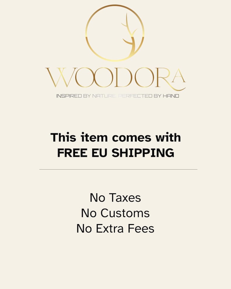 May include: A graphic design featuring a gold circular logo with a stylized tree branch inside, positioned above the text WOODORA in a serif font, followed by the tagline INSPIRED BY NATURE PERFECTED BY HAND in a smaller sans-serif font.