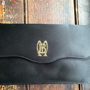 Vintage Bruno Magli Couture Black Satin monogrammed evening bag with gold leather interior