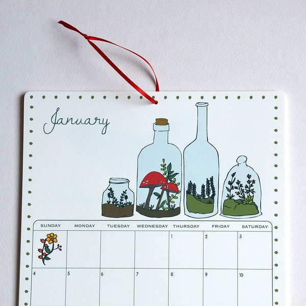 2015 Wall Calendar, 8.5x11 inches featuring 12 different woodland illustrations in blue, red, brown, green, orange and yellow