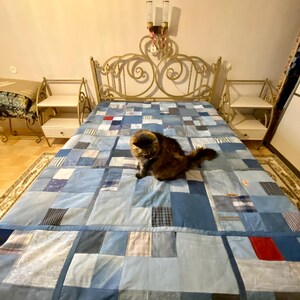 • Material: Made with high-quality, upcycled denim and soft cotton fabric for durability and comfort.
 • Design: A beautiful patchwork pattern featuring various shades of blue, accented by pops of color for a modern, rustic aesthetic.