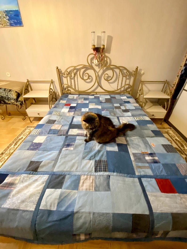 • Material: Made with high-quality, upcycled denim and soft cotton fabric for durability and comfort.
 • Design: A beautiful patchwork pattern featuring various shades of blue, accented by pops of color for a modern, rustic aesthetic.