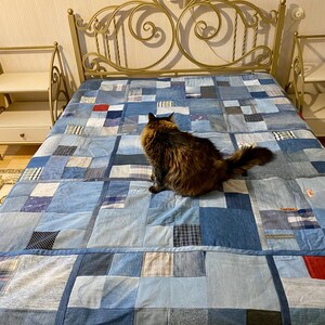 • Material: Made with high-quality, upcycled denim and soft cotton fabric for durability and comfort.
 • Design: A beautiful patchwork pattern featuring various shades of blue, accented by pops of color for a modern, rustic aesthetic.