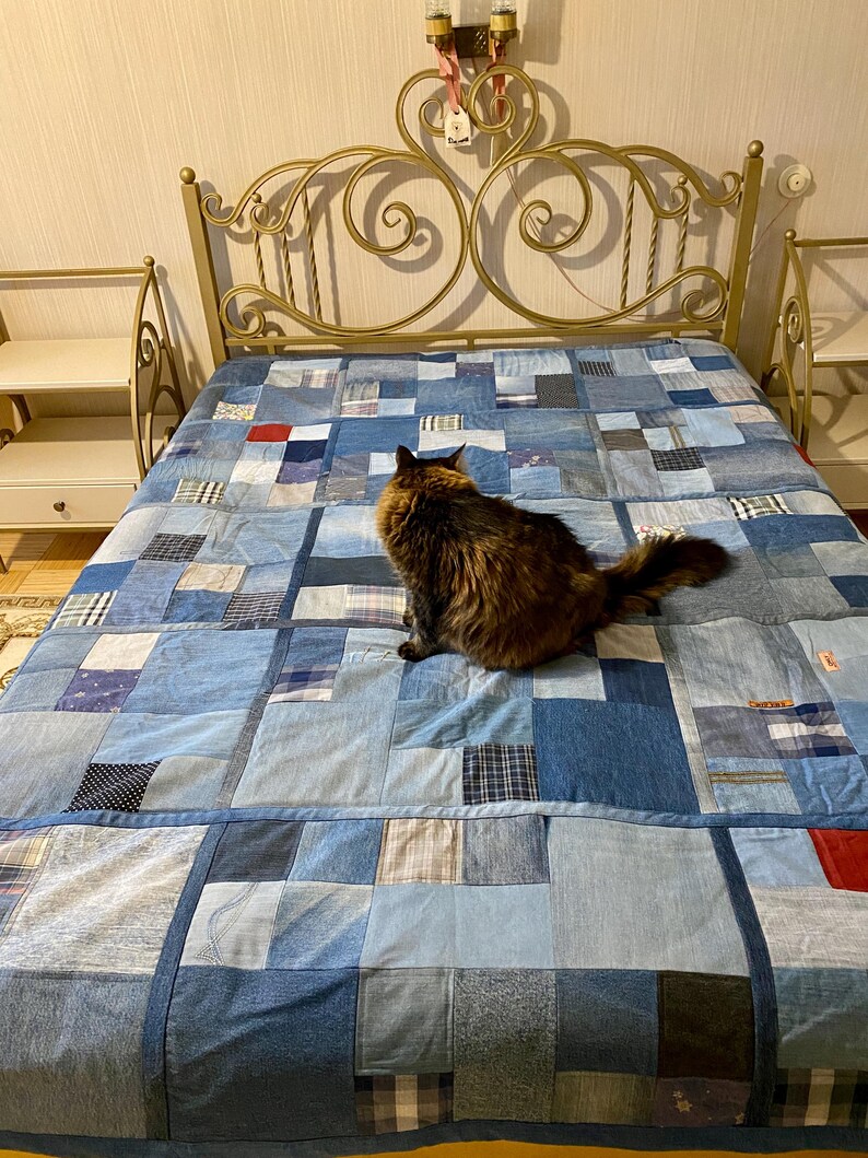 • Material: Made with high-quality, upcycled denim and soft cotton fabric for durability and comfort.
 • Design: A beautiful patchwork pattern featuring various shades of blue, accented by pops of color for a modern, rustic aesthetic.
