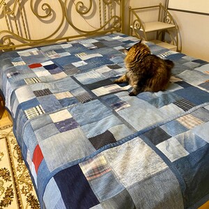 • Material: Made with high-quality, upcycled denim and soft cotton fabric for durability and comfort.
 • Design: A beautiful patchwork pattern featuring various shades of blue, accented by pops of color for a modern, rustic aesthetic.