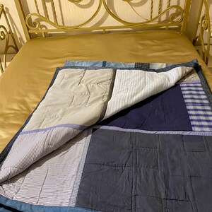 • Material: Made with high-quality, upcycled denim and soft cotton fabric for durability and comfort.
 • Design: A beautiful patchwork pattern featuring various shades of blue, accented by pops of color for a modern, rustic aesthetic.