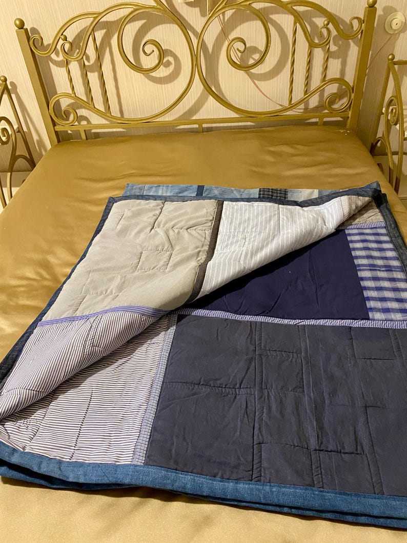 • Material: Made with high-quality, upcycled denim and soft cotton fabric for durability and comfort.
 • Design: A beautiful patchwork pattern featuring various shades of blue, accented by pops of color for a modern, rustic aesthetic.