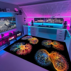 May include: A gaming room with a large screen showing a video game, a desk with multiple monitors, and a black rug with colorful, abstract designs. The room is lit with neon lights.