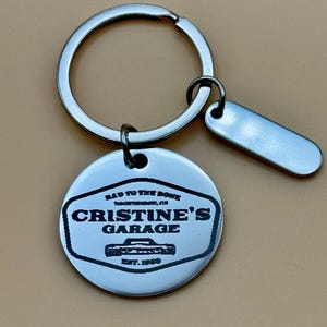 Custom lasered keychain featuring, from Stephen King, one “Bad To The Bone“ car, Christine.