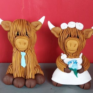 Hand made personalised highland cow wedding cake toppers