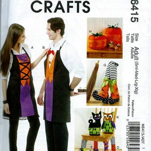 May include: McCall's Crafts Halloween costume pattern M6415. The image shows a woman and a man wearing aprons, along with other Halloween-themed crafts, including pumpkin decorations, witch legs, and cat and owl chair covers. The pattern is for adult sizes.