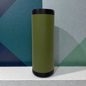May include: A cylindrical beverage cooler with a matte olive green body and a solid black rim at both the top and the bottom. The container features a smooth, uniform finish and a straight-sided design, providing a simple and functional structure.
