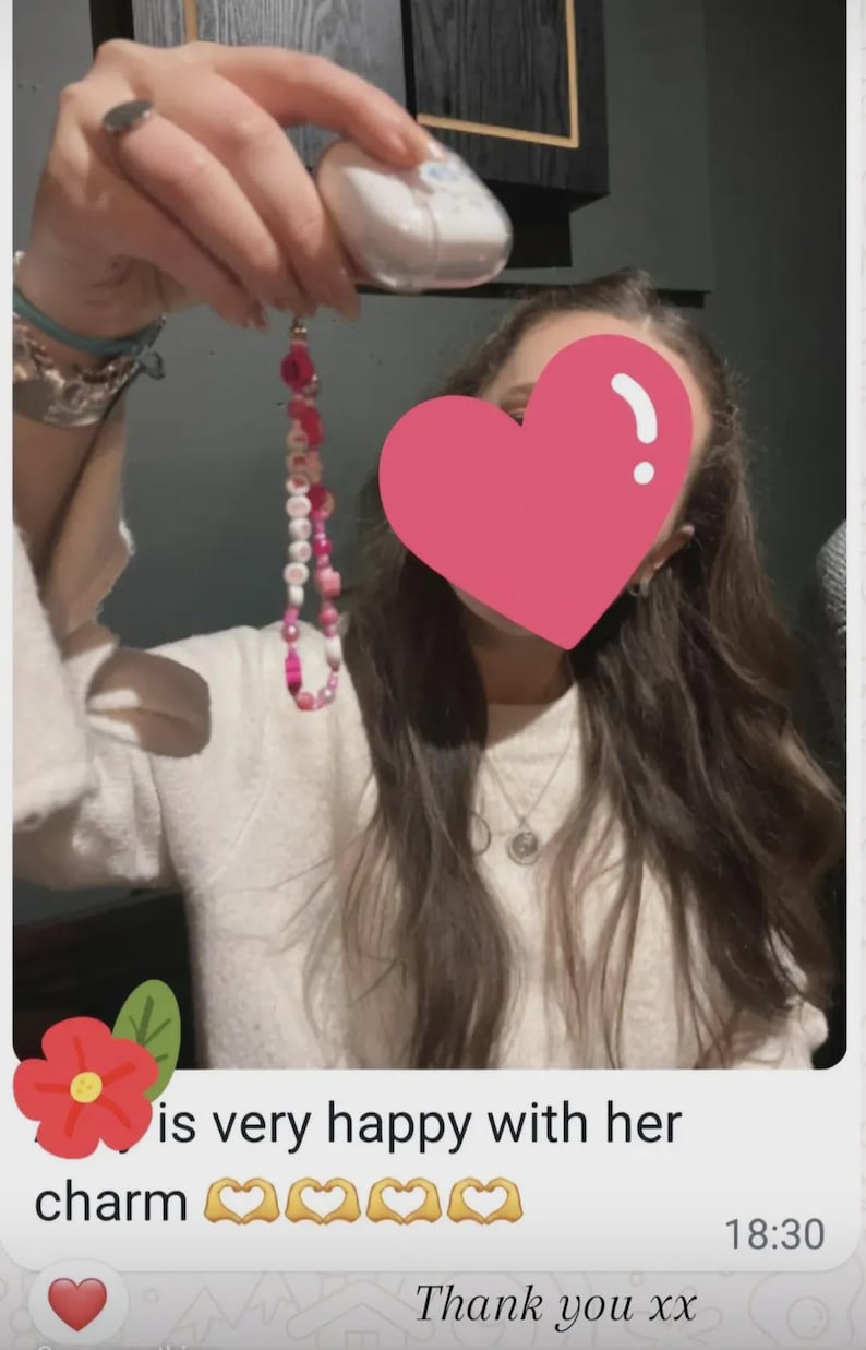 Handmade pink phone charm that is fully customisable. Each pink Y2K phone charm is made from upcycled pink beads, personalised with your name. Each custom phone charm is unique and makes a great gift for her, perfect for the Y2K trend. The pink phone straps are super cute and personalised, making a great Y2K phone accessory. The beaded pink phone wristlet is a great Y2K phone charm for any pink lover.