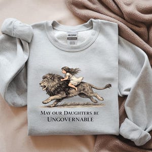 May include: A rustic wooden sign with the text "Welcome to our home" in white lettering. The sign features a distressed finish and a simple, inviting design, perfect for entryway decor.